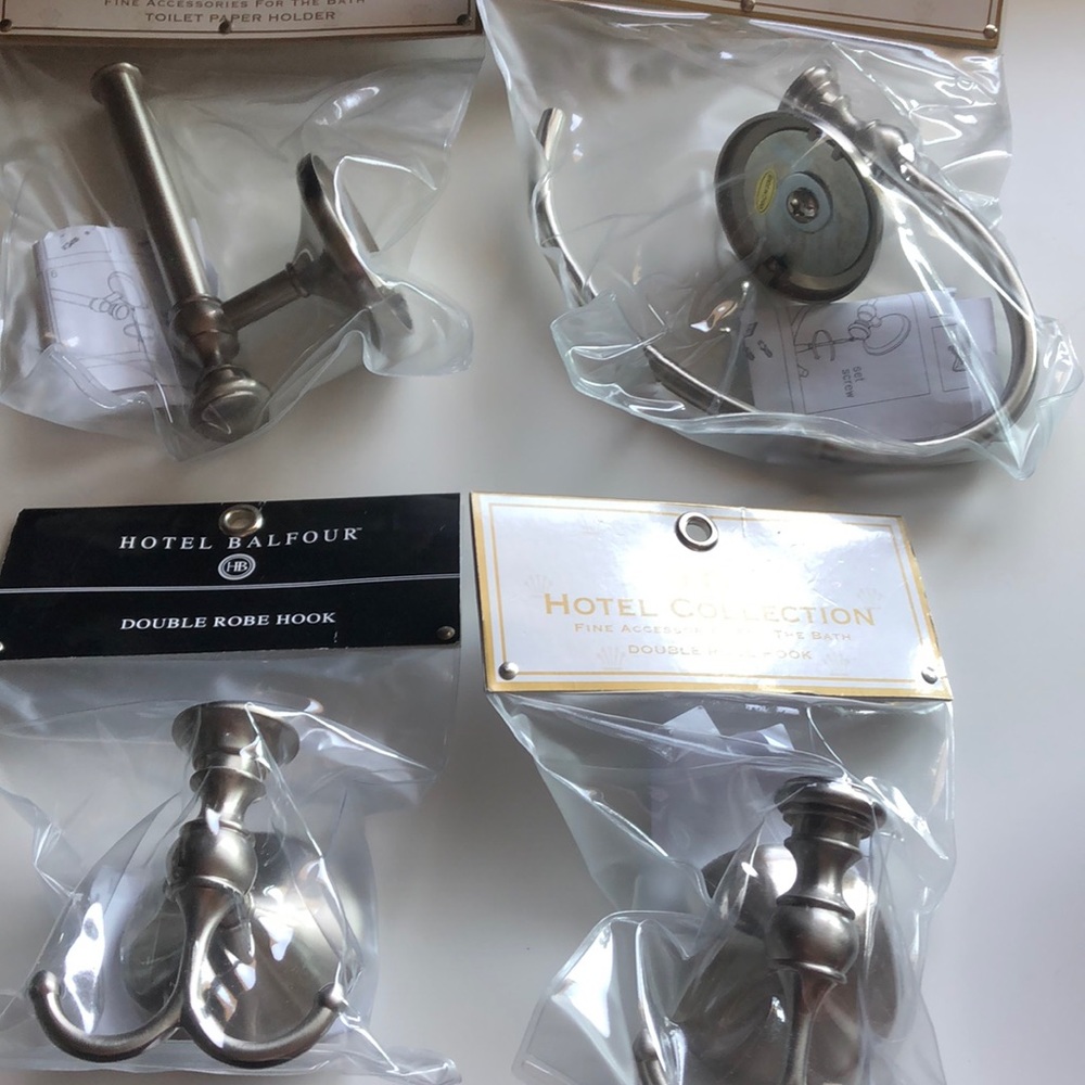 Remodeling? Updating? 2 robe/towel hooks hand towel, 1 TP holder, pewter.